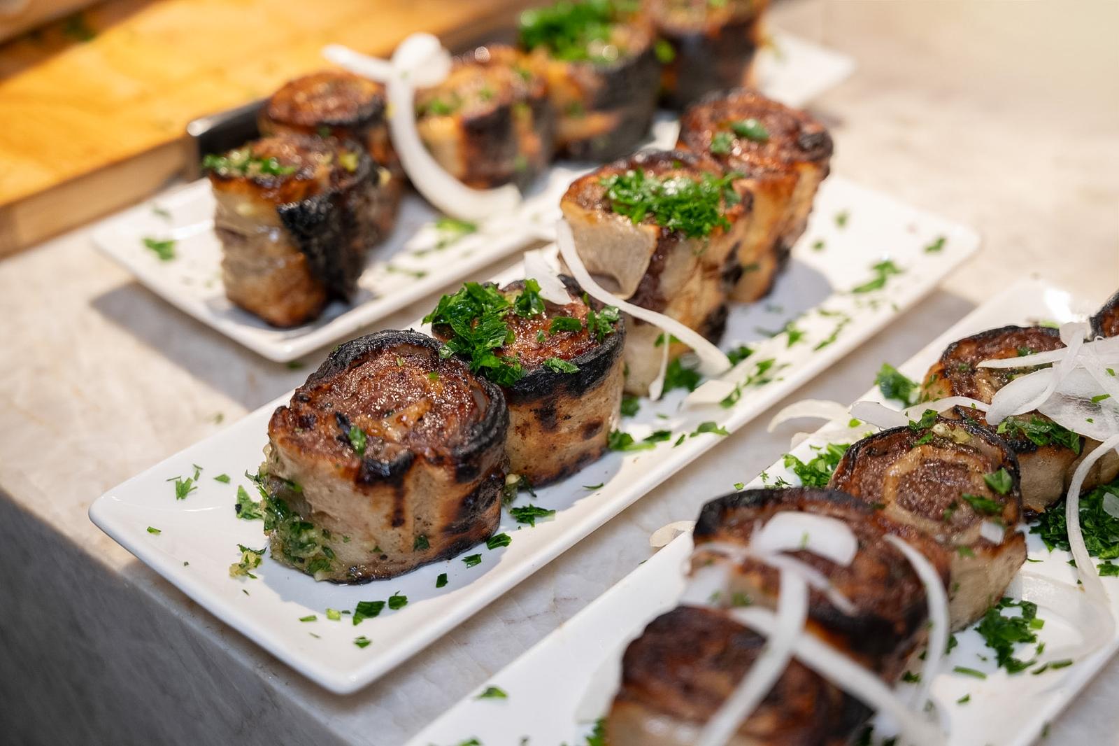 Individual grilled bites finished with herbs